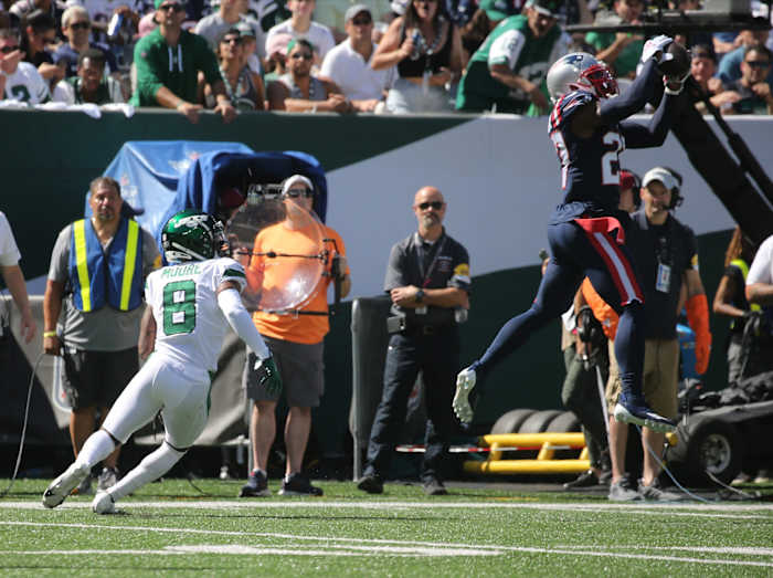 Intended receiver Elijah Moore of the Jets watches as J.C. Jackson of the Patriots intercepts a pass. Chris Pedota, NorthJersey.com via Imagn Content Services, LLC